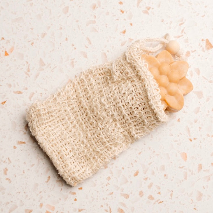 Soap bar in soap saver bag.