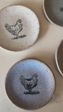 Video panning across mini-plates with chicken, cowboy boot, and moose designs.